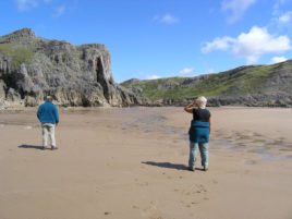 Looking at the dramatic limestone cliffs that surrouns Mewslade Bay in Rhossili.