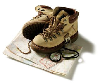 Walking boots, compass and map