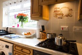 The fully fitted kitchen at Brynymor Cottage holiday accommodation, Llangennith, Gower