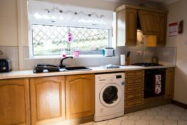 The fully fitted kitchen at Brynymor Cottage self-catering accommodation, Llangennith, Gower