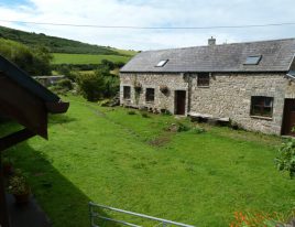 Delvid Stables holiday cottage and courtyard at Llangennith, Gower