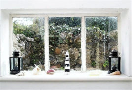 Porch window of Limetree Cottage Port Eynon self-catering Gower Peninsula