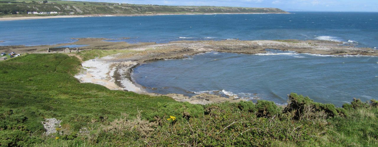 Salthouse Mere runs into Port Eynon Bay on the Gower Peninsula