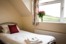 One of the twin beds at Brynymor Cottage holiday accommodation, Llangennith, Gower