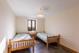 The twin bedroom at The Tractor House self-catering cottage, Llethryd, Gower