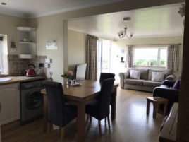 The dining area at Coastal View self-catering apartment, Oxwich, Gower