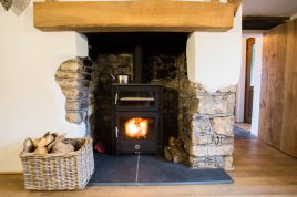 The log burner stove at The Bower Cottage self-catering cottage Port Eynon, Gower
