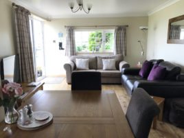 The lounge at Coastal View holiday apartment, Oxwich, Gower