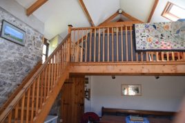 The staircase to the TV room at Delvid Stables holiday cottage, Llangennith, Gower