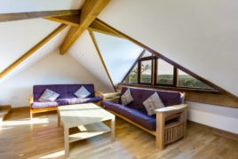 The sitting area upstairs at The Tractor House holiday accommodation, Llethryd, Gower