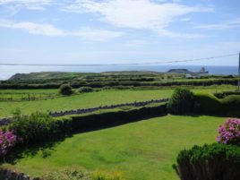 The front garden and view towards Worms Head at Faircroft, Rhossili